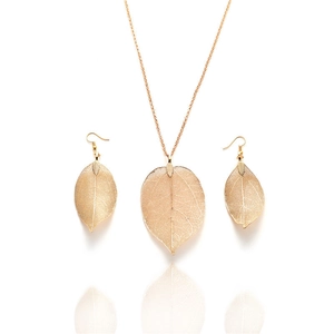 Elegant gold leaf jewelry set with skeletonized leaf necklace and matching earrings