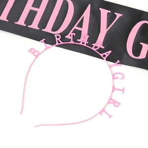 Close-up of pink Birthday Girl headband and satin sash set for party celebration