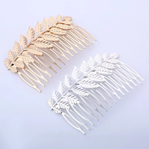 Close-up of gold and silver leaf hair combs with Greek goddess style metal textures