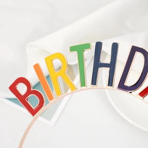 Macro detail of rainbow enamel BIRTHDAY girl headband with polished rose gold finish