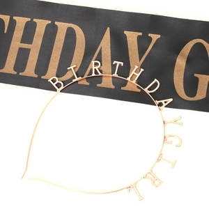 Detail of rose gold BIRTHDAY GIRL metal headband and black satin sash set for parties