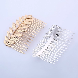 Elegant gold and silver leaf-shaped metal hair combs with textured leaves for bridal styling