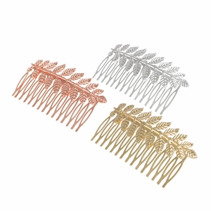 Three-piece set of elegant leaf-shaped metal hair combs in rose gold, silver and gold