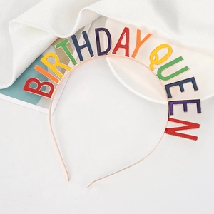 Rose gold Birthday Queen rhinestone headband on white silk backdrop for party celebration