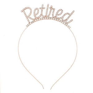Close-up of rose gold retired headband featuring sparkling white rhinestones on letters