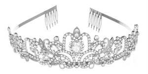 Close-up of silver crystal crown featuring a large pear-shaped diamond and side hair combs