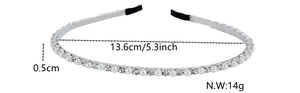 Détail d'un serre-tête en métal avec perles et strass montrant le diamètre et le poids de 14 g