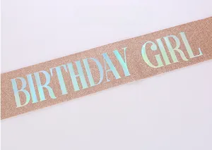 Detail of rose gold glitter birthday girl sash with holographic laser lettering finish