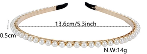 Detail view of a 13.6cm gold metal headband with pearls and black protective ends