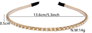 Detailed view of a slim gold metal headband with pearls and rhinestones, weight 14g
