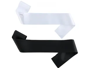 Close-up of black and white Birthday Girl sashes with colorful rainbow lettering