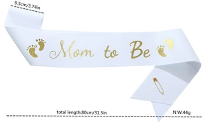 Detailed view of Mom to Be white satin sash with gold lettering and size dimensions