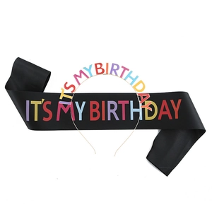 Detail of black satin sash and metal headband with colorful It's My Birthday lettering