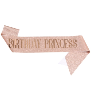 Detail of pink gold glitter Birthday Princess sash with shiny metallic gold lettering