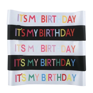 Close-up of rainbow font It's My Birthday sash in black and white satin fabric