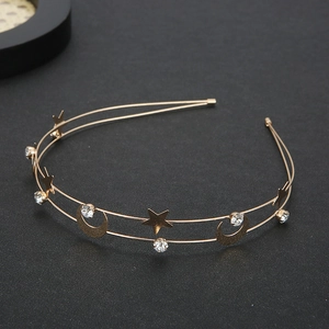 Detailed view of golden double-layer headband with celestial stars, moons and crystals