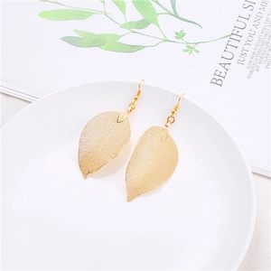 Golden leaf-shaped dangle earrings with intricate hollow vein textures and hooks