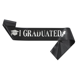 Detail of black satin graduation sash featuring silver I GRADUATED text and academic icons