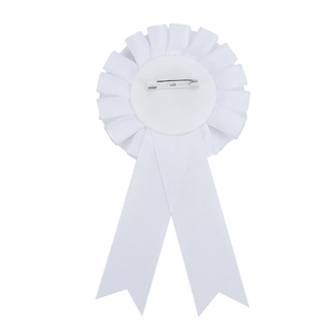 Detail view of the white satin ribbon rosette back featuring a secure metal safety pin