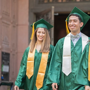 Close-up of silk graduation sash and green academic gown with tassel during ceremony