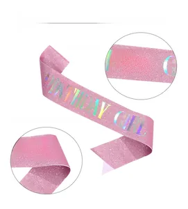 Detailed view of pink glitter birthday girl sash with holographic gold foil lettering