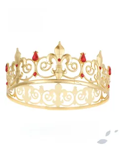 Detailed macro view of gold plated royal crown with red crystals and fleur-de-lis pattern
