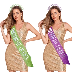 Detail of glitter Birthday Queen sash and tiara set in light green and purple colors