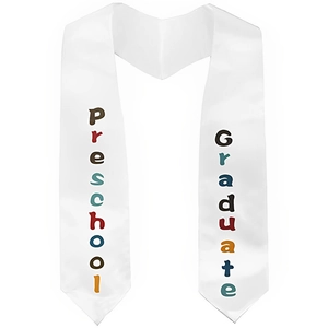 Detailed macro view of white satin preschool graduate stole with colorful lettering