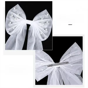 Elegant white tulle bow hair clip with faux pearls for bridal or bridesmaid wedding style
