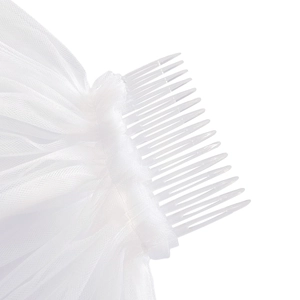 Detail of bridal veil with transparent plastic comb attached to white layered mesh fabric