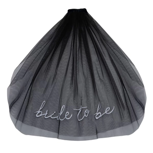 Close-up of black mesh bridal veil with silver embroidered Bride to be cursive text