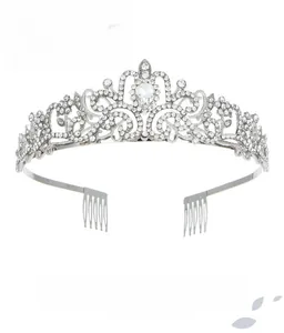 Detail of silver alloy crown with white crystals and fixed side hair combs