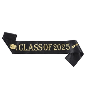 Close-up of black satin Class of 2025 sash with gold foil text and graduation icons