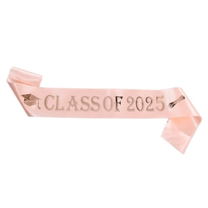 Close-up of pink satin Class of 2025 sash with rose gold lettering and graduation icons