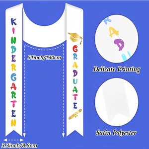 Detail view of white kindergarten graduation sash with colorful print and golden motifs