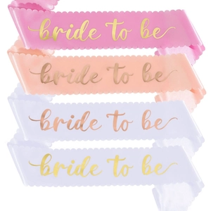 Scalloped edge Bride to Be sashes in pink peach and white colors for bachelorette parties