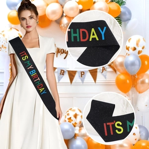 Glittery black birthday sash with colorful IT'S MY BIRTHDAY text for party decorations