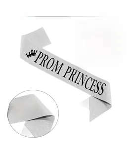 Detail of silver glitter Prom Princess sash with black crown lettering for parties