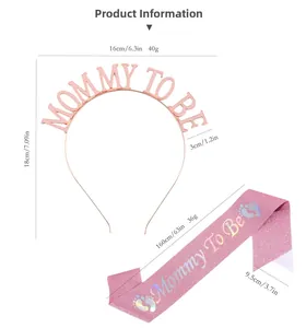 Detailed view of rose gold Mommy To Be headband and pink glitter baby shower sash