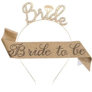 Close-up of glittery gold Bride to Be sash and rhinestone headband for bachelorette parties