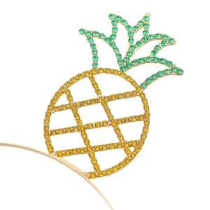 Close-up of sparkling pineapple headband with yellow and green crystals for beach party