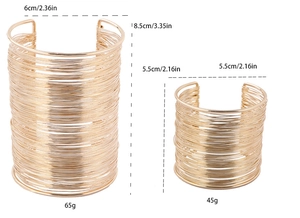Detail of hollow gold multi-layer wire-wrapped cuffs showing different size measurements