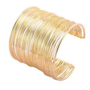 Minimalist gold multi-layer wire cuff bracelet with open adjustable design on white background