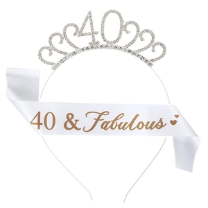 Close-up of 40th birthday set with silver rhinestone crown and 40 & Fabulous white sash