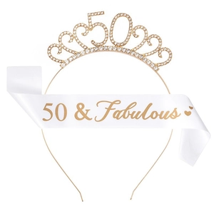 Detail of gold 50th birthday rhinestone crown and white 50 & Fabulous satin sash set