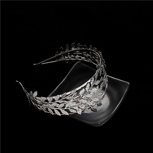 Macro shot of silver laurel leaf crown headband showing metallic veins and texture