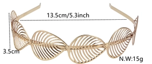 Detailed view of golden leaf headband with 13.5cm width and 15g weight measurements