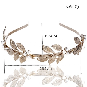 Detailed view of golden leaf headband with pearls showing 15.5cm height and 47g weight