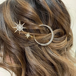 Vintage star and moon hair clip set with sparkling rhinestones in a gold finish