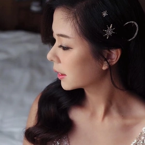 Vintage silver star and moon hair clip set with sparkling rhinestones on female model